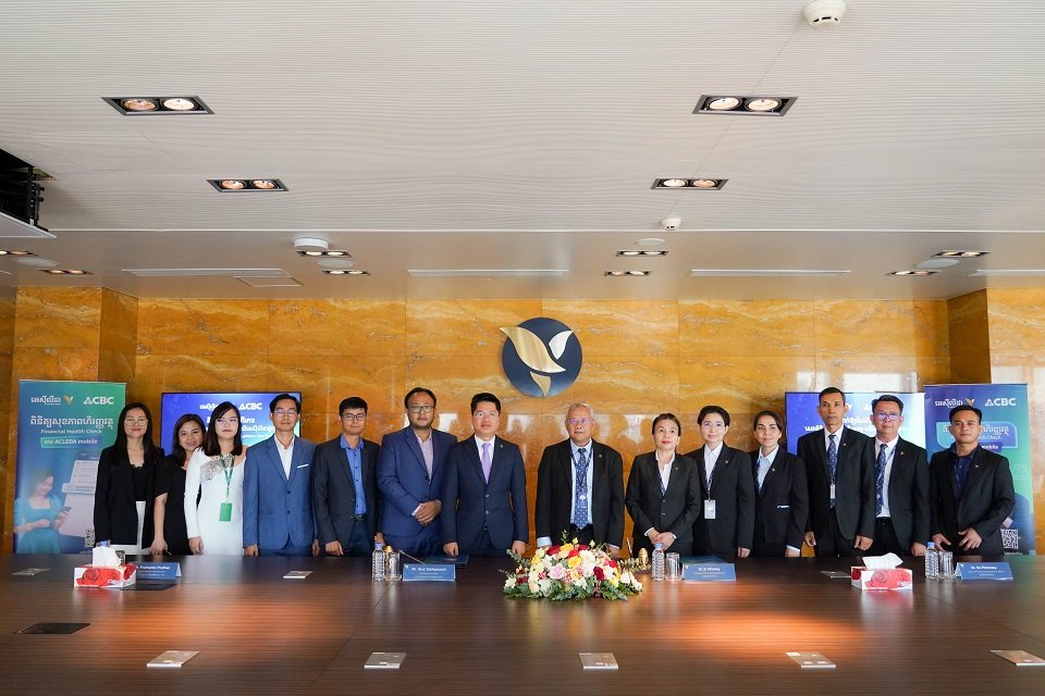 [from left to right] Group photos: Management of Credit Bureau (Cambodia) Co., Ltd.; Management of ACLEDA Bank Plc.